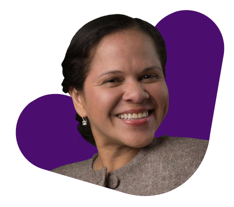 Purple Background With Smiling Person In Front.